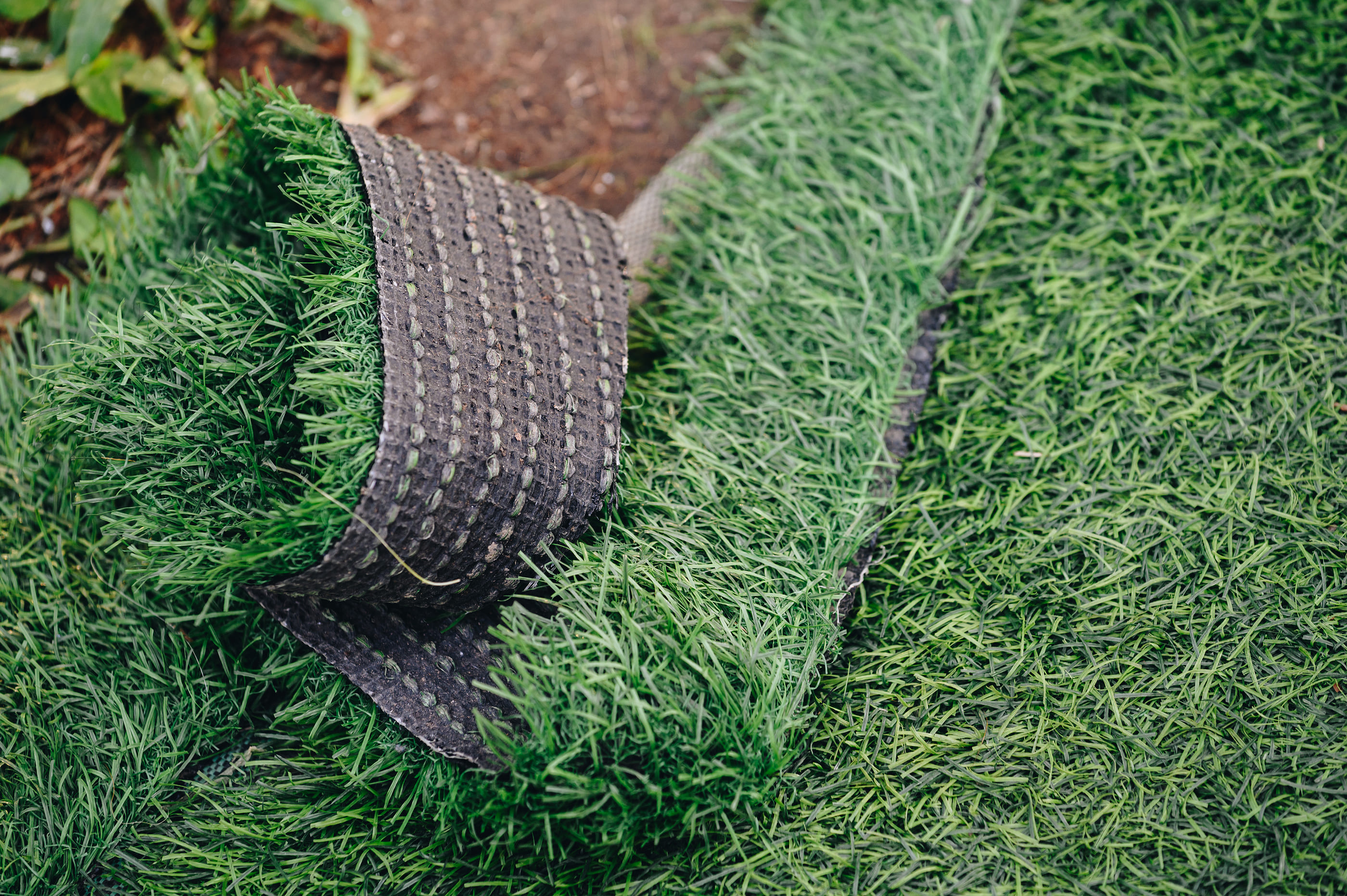 laying down artificial grass
